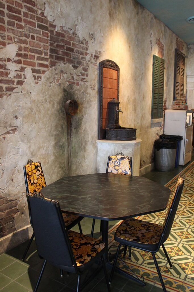 Distressed wall with traditional cement tiles